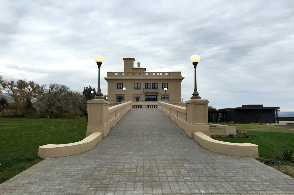 Image of Maryhill Museum from a bridge with two light poles on both sides