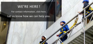 Three people in a construction lift. Text box "We're Here! Let us know how we can help"