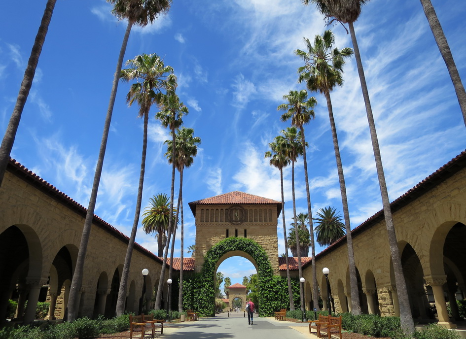 East Gate Clock Tower with blue sky and palm trees