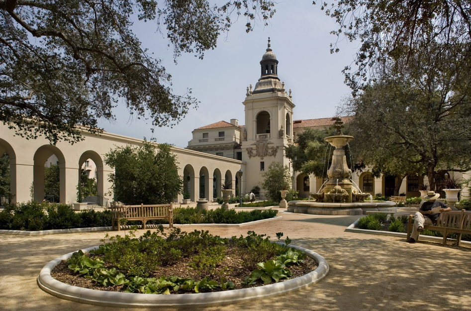 Garden view of the City Pasadena City Hall, two benches and beautiful green landscape around