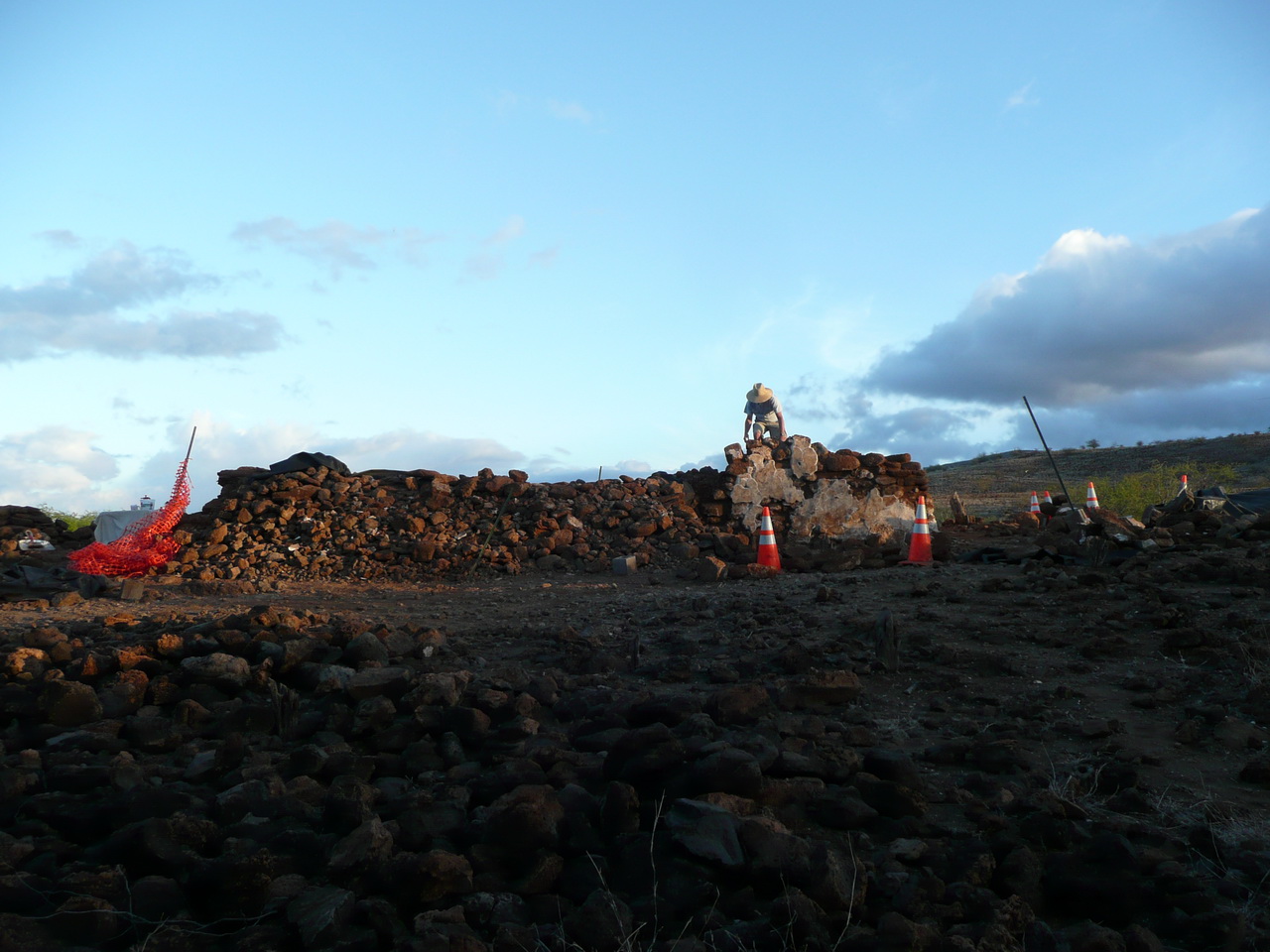 Image with a man standing on top of stones