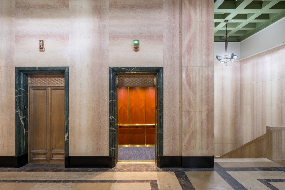 Interior shot of Trust's elevators, showing one open to reveal the wooden back
