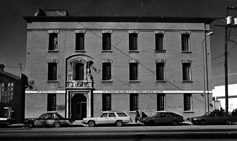 black and white front of woman's building entrance